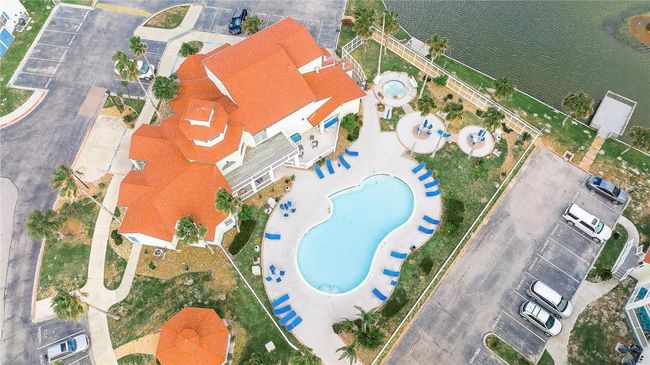 Club house, pool, hot tub, lake. And walking distance to the beach. | Image 28
