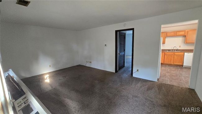 Unfurnished room with a sink and dark carpet | Image 7