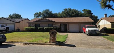 Single story home with a front lawn and a garage | Image 2