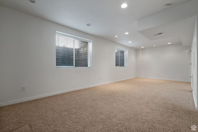 Spare room featuring recessed lighting and light carpet | Image 21