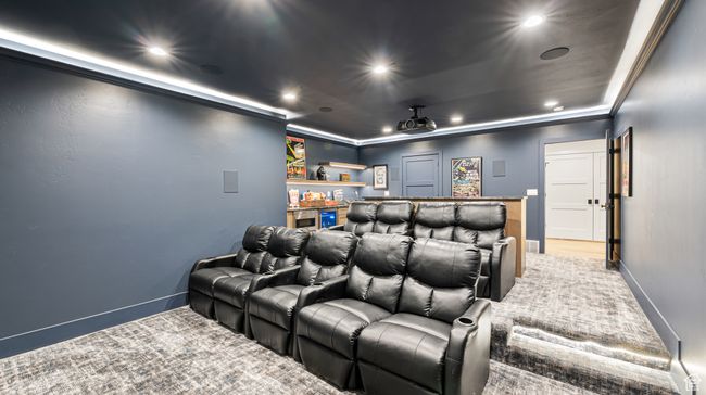 Home theater with baseboards, a bar, and recessed lighting | Image 34
