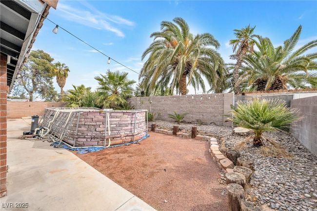 View of yard featuring a patio and a fenced backyard | Image 24