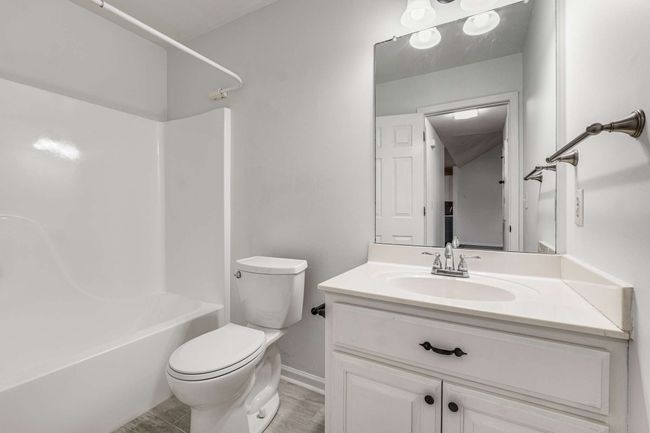 Hall bath with new faucet and new tile floor | Image 21