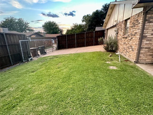 Yard at dusk featuring a patio area and driveway | Image 39