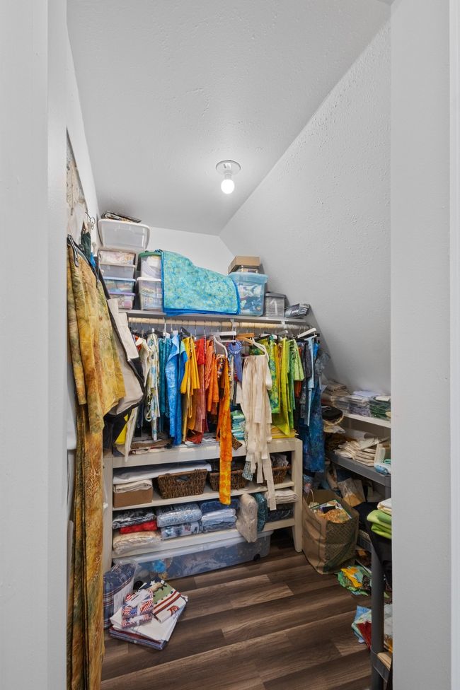 Walk in closet featuring wood finished floors and vaulted ceiling | Image 31