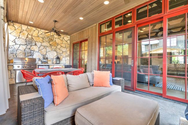 LOUNGE IN THIS OUTDOOR LIIVNG AREA OFF OF THE MAIN LIVING ROOM AND KITCHEN | Image 27