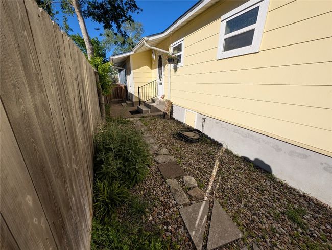 View of home's exterior with fence | Image 21