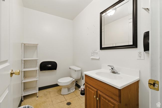 Half bath with vanity and tile patterned floors | Image 18