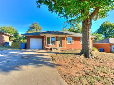 View of front of house with a garage | Image 1