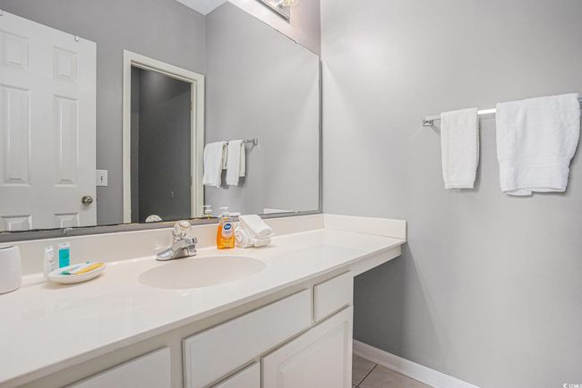 Bathroom with vanity and tile patterned flooring | Image 14