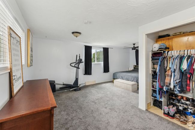 Carpeted bedroom with a closet | Image 16