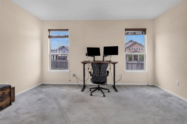 Unfurnished office featuring carpet, healthy amount of natural light, and baseboards | Image 16