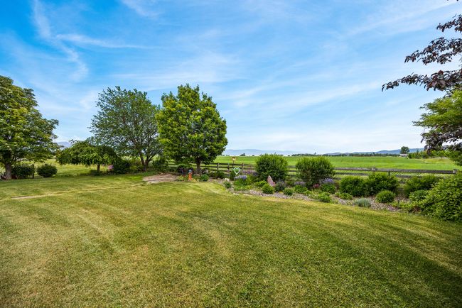 View over farmland to the lake to the mountains | Image 7