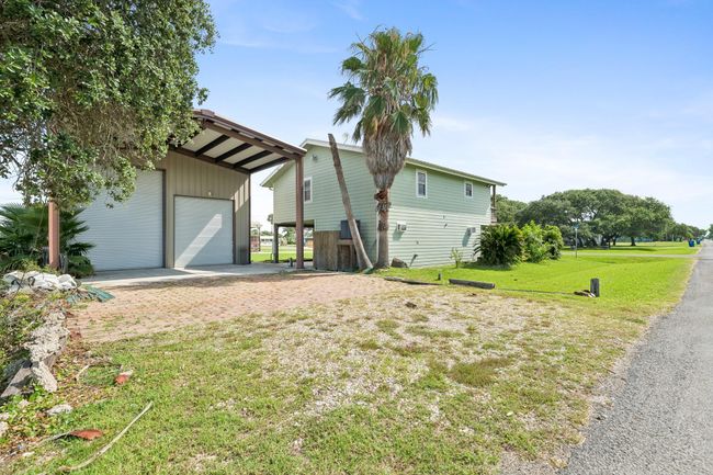 Street view of the boat barn and the back of the house | Image 6