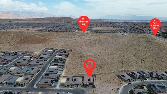 Aerial perspective of suburban area with a mountain backdrop and a desert landscape | Image 41