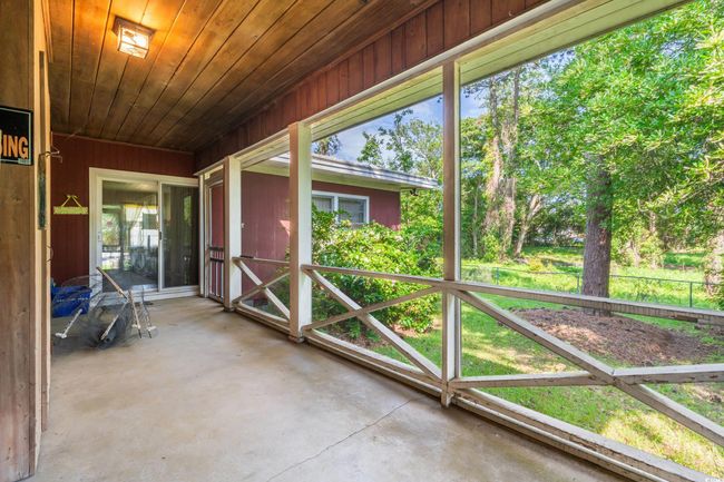View of unfurnished sunroom | Image 23