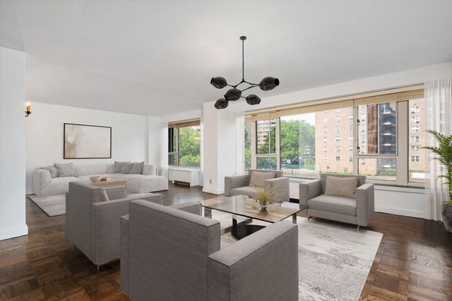 Virtually Staged Living area featuring baseboards and a chandelier | Image 5