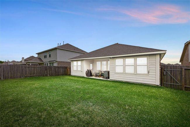 From morning coffee to evening gatherings, this backyard offers endless possibilities for outdoor enjoyment. | Image 19