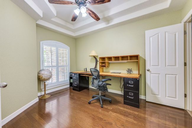 One of four bedrooms, currently used as an office. | Image 15