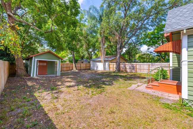 A spacious backyard with new fencing and a blank canvas for your ideas. | Image 34
