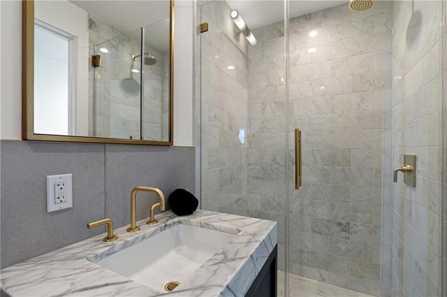 Bathroom with a stall shower and vanity | Image 20