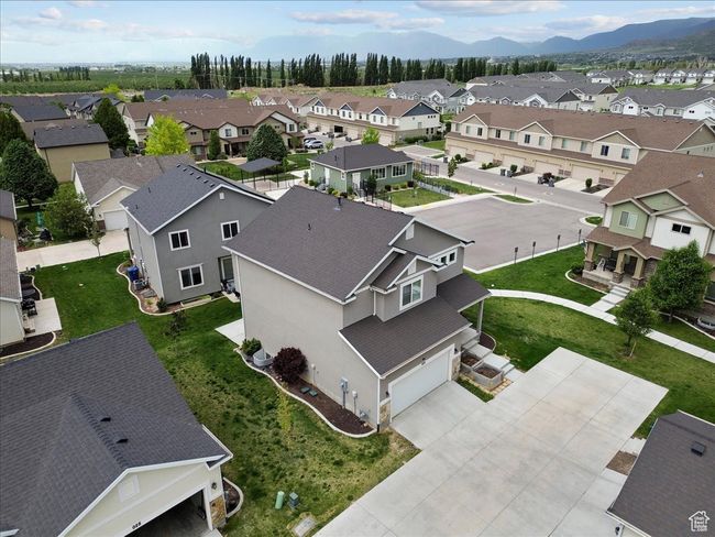 Aerial perspective of suburban area with a mountainous background | Image 4
