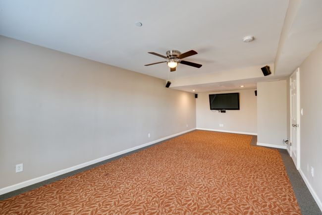 Fully finished basement with 3 large rooms. Bring your favorite recliner for movie night in the media room. | Image 32