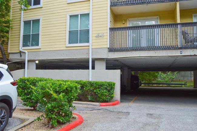 View of building exterior with covered parking | Image 33