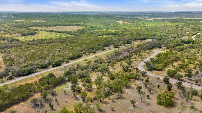 Aerial view of property's location featuring a heavily wooded area | Image 8