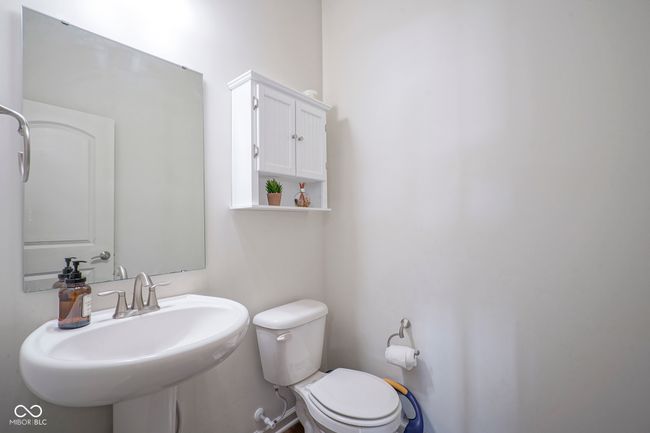half bath with toilet and a sink | Image 10