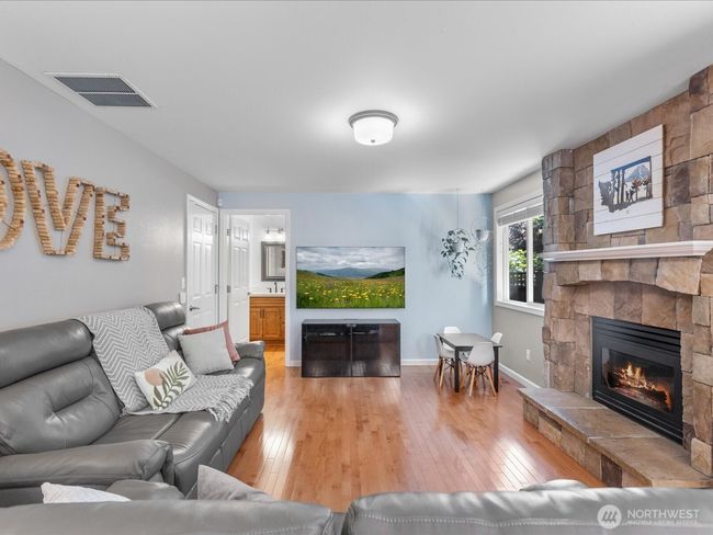 Open family room with custom stone gas fireplace | Image 15