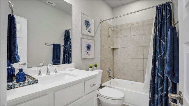 Full bath with shower / tub combo, vanity, toilet, and visible vents | Image 23