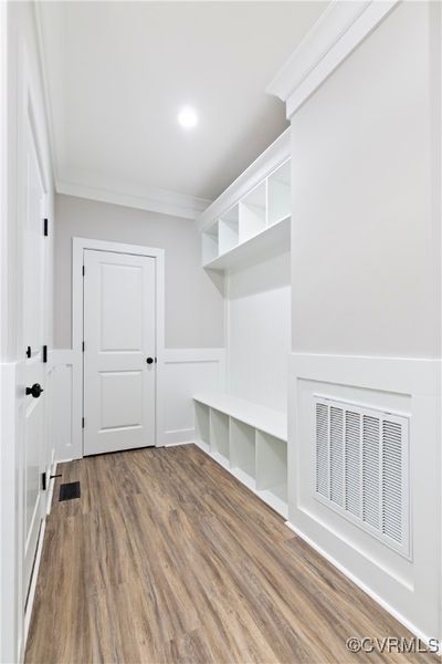 Mudroom featuring hardwood / wood-style flooring and ornamental molding | Image 2