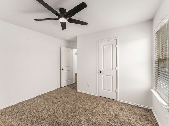Unfurnished bedroom featuring carpet and ceiling fan | Image 24