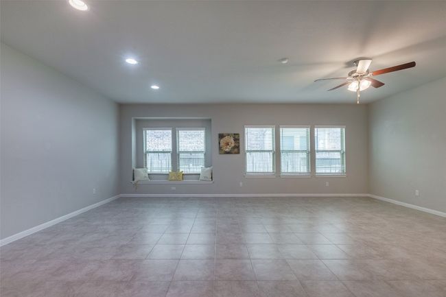 Empty room featuring recessed lighting, baseboards, ceiling fan, and light tile patterned floors | Image 39