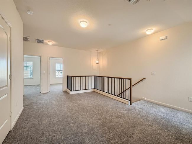 Carpeted spare room featuring baseboards | Image 10
