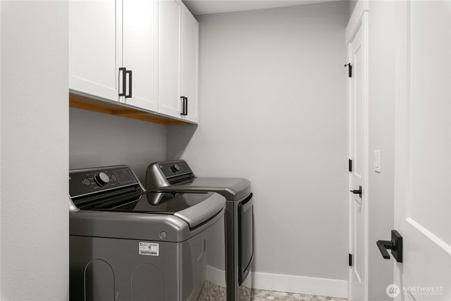 Utility room with a closet for extra storage | Image 29