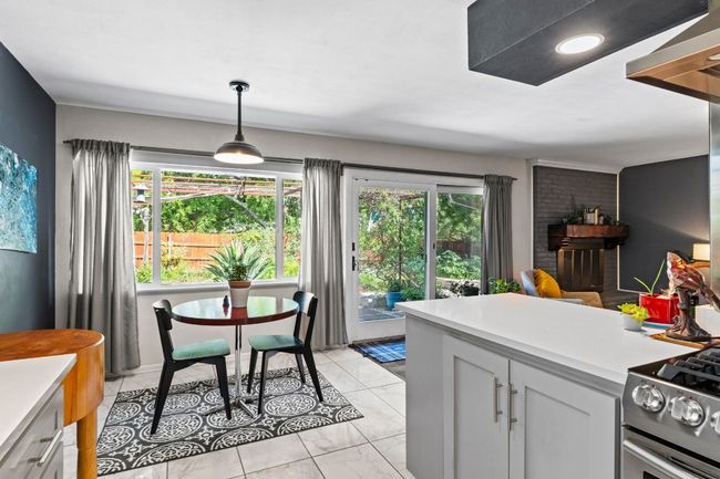 The eat-in kitchen provides space for a cozy breakfast table where you can enjoy coffee while taking in the gorgeous backyard view! | Image 6