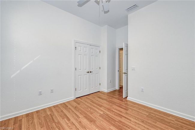 Unfurnished room with light hardwood / wood-style floors and ceiling fan | Image 14