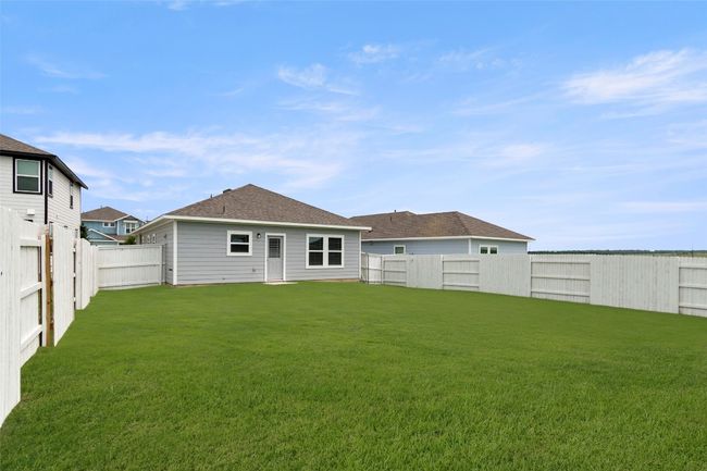 Back of house with a yard and a fenced backyard | Image 10