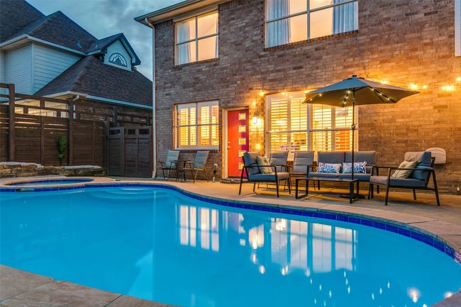 View of swimming pool featuring an outdoor hangout area, an in-ground hot tub, and a patio | Image 26