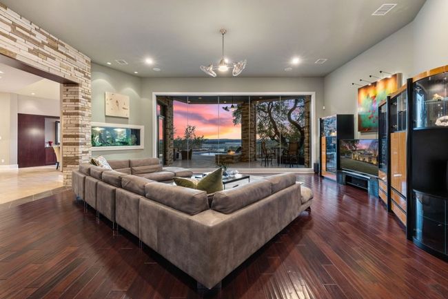 View from the dining room through the aquarium to the living room. | Image 8