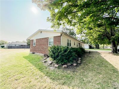 View of side of property with a lawn | Image 2