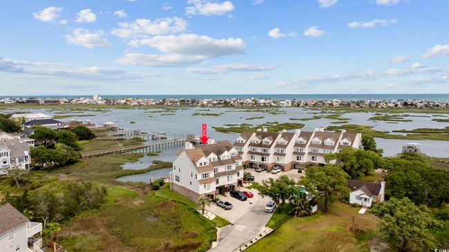 Aerial view of residential area with a nearby body of water | Image 4