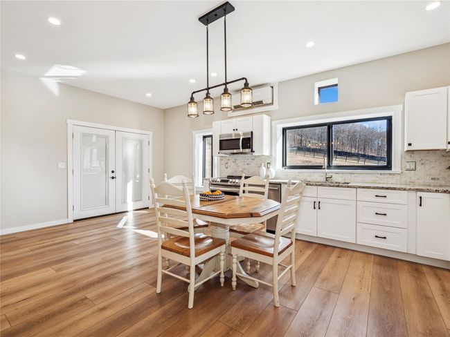 Sun-filled living space with open floor plan | Image 9