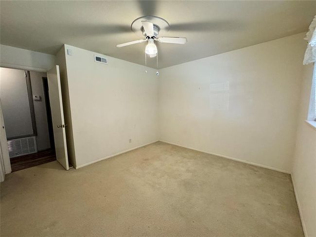 Carpeted spare room with ceiling fan | Image 31
