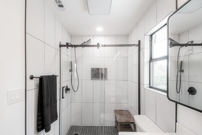 The primary bathroom offers a large walk in glass shower. WOW! | Image 24