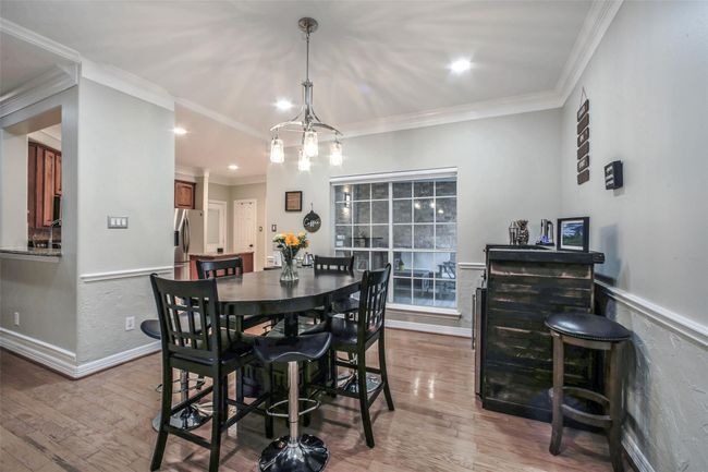 Dining area that is open to the kitchen. Perfect for entertaining and family meals. | Image 12