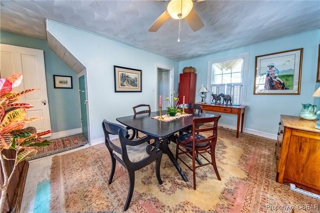 Dining area featuring baseboards and ceiling fan | Image 8