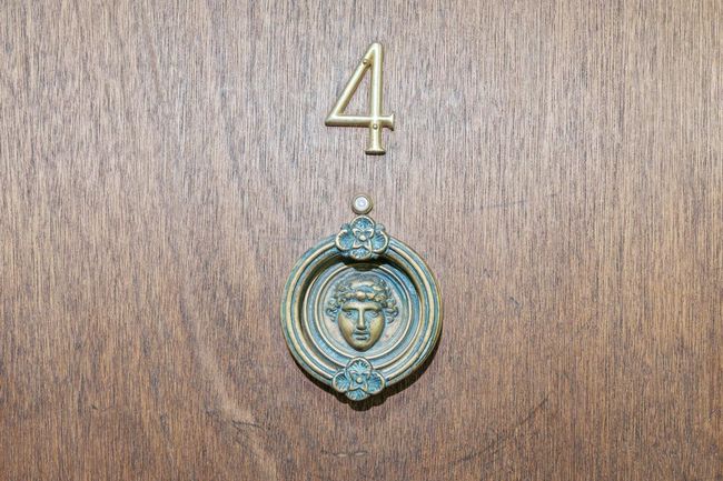 The Roman door knocker is a hint of what you'll see inside. Unit #4 has been combined with #6 for a unique space. | Image 28
